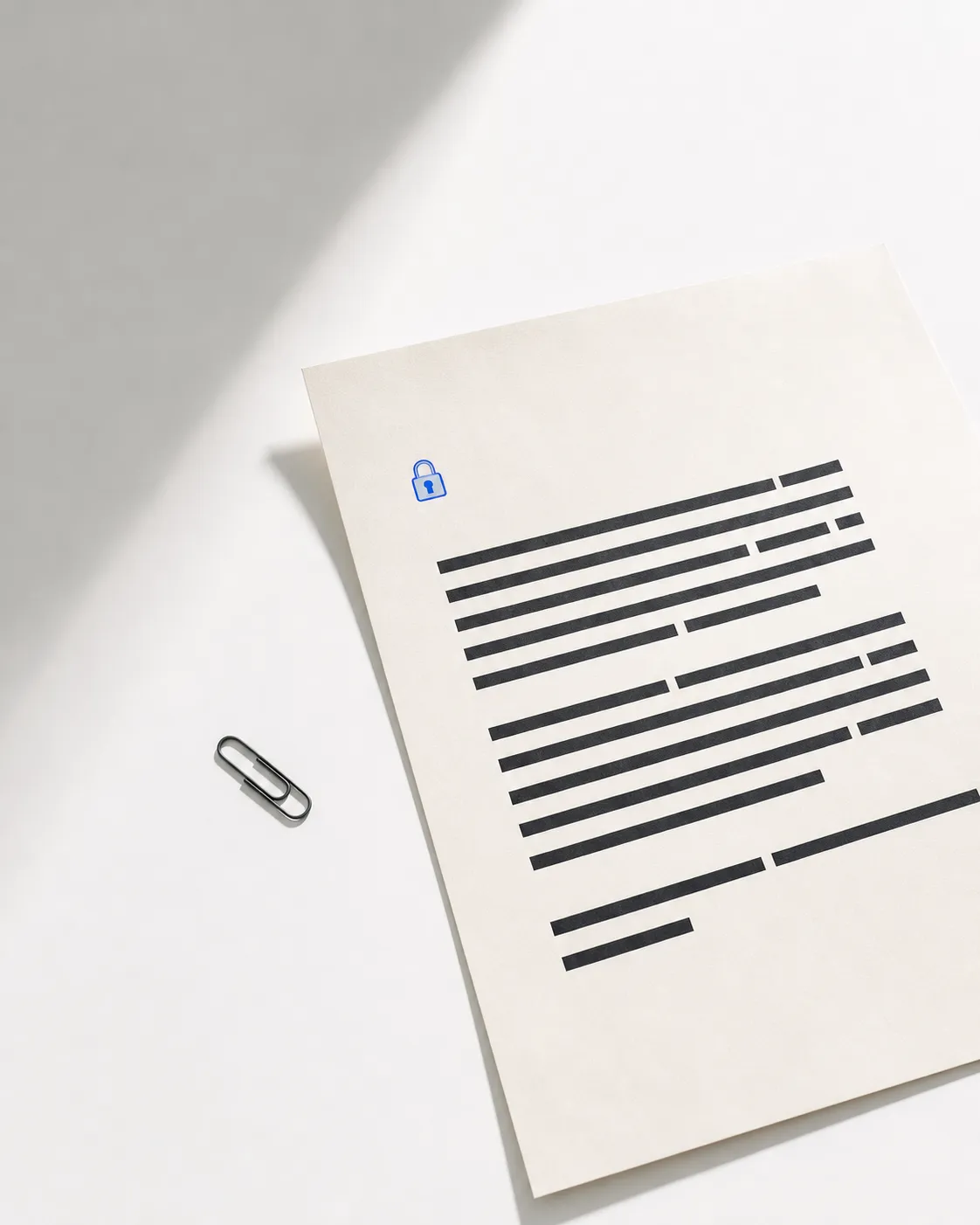 A paper document with a blue lock mark on a white desk